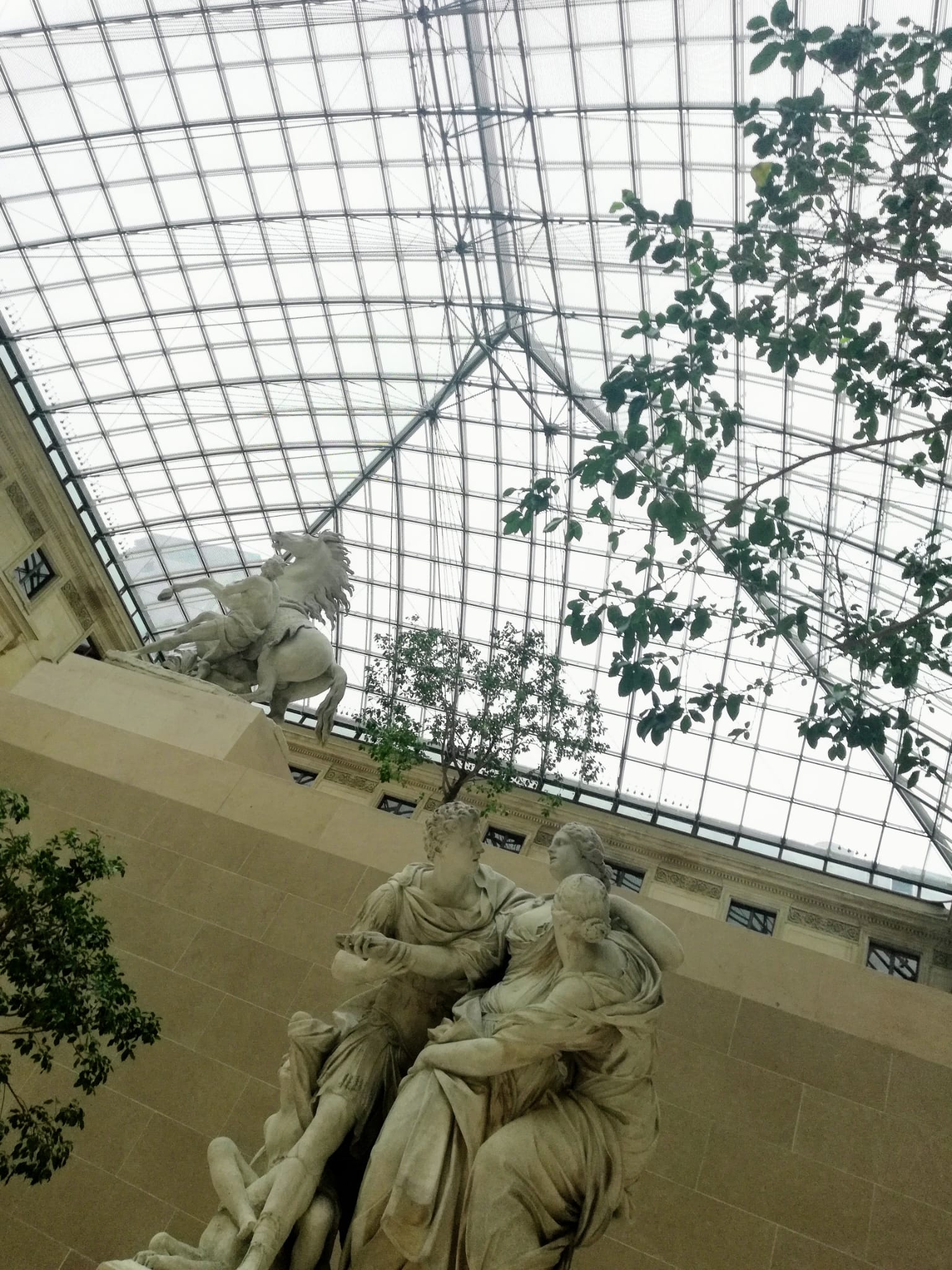 An image of statues from the Louvre