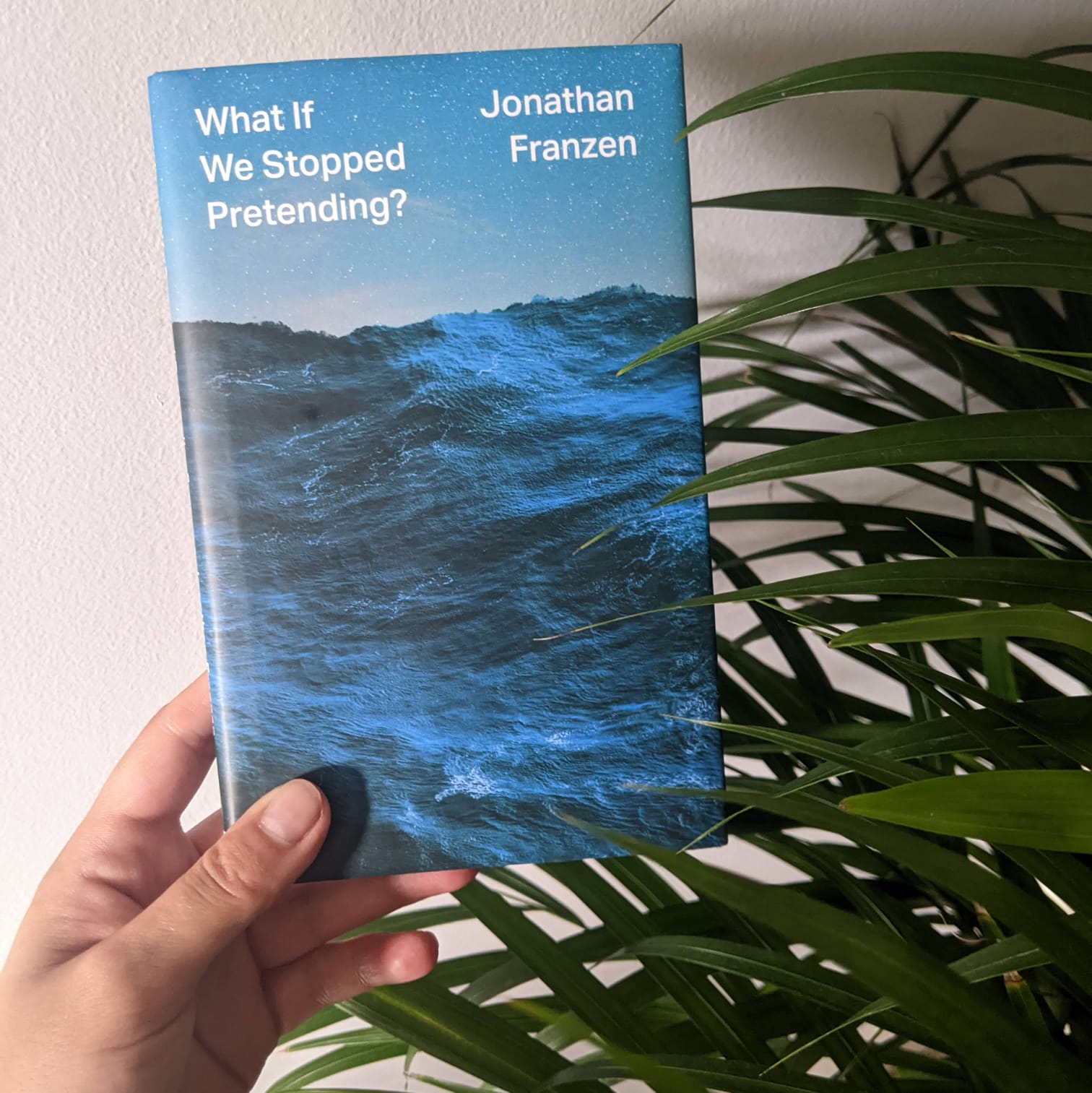 A picture of a copy of What If against a grey backdrop