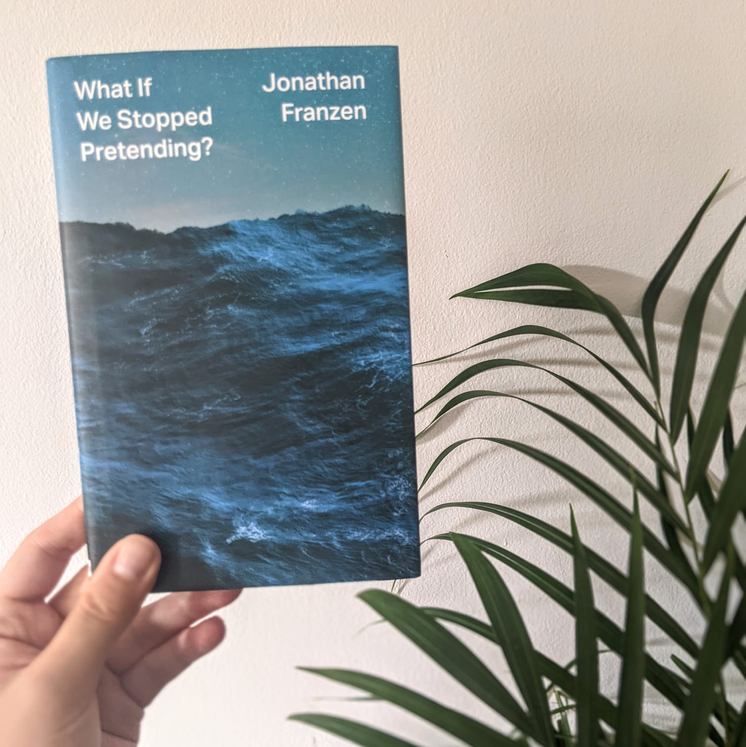 A picture of a copy of What If against a grey backdrop