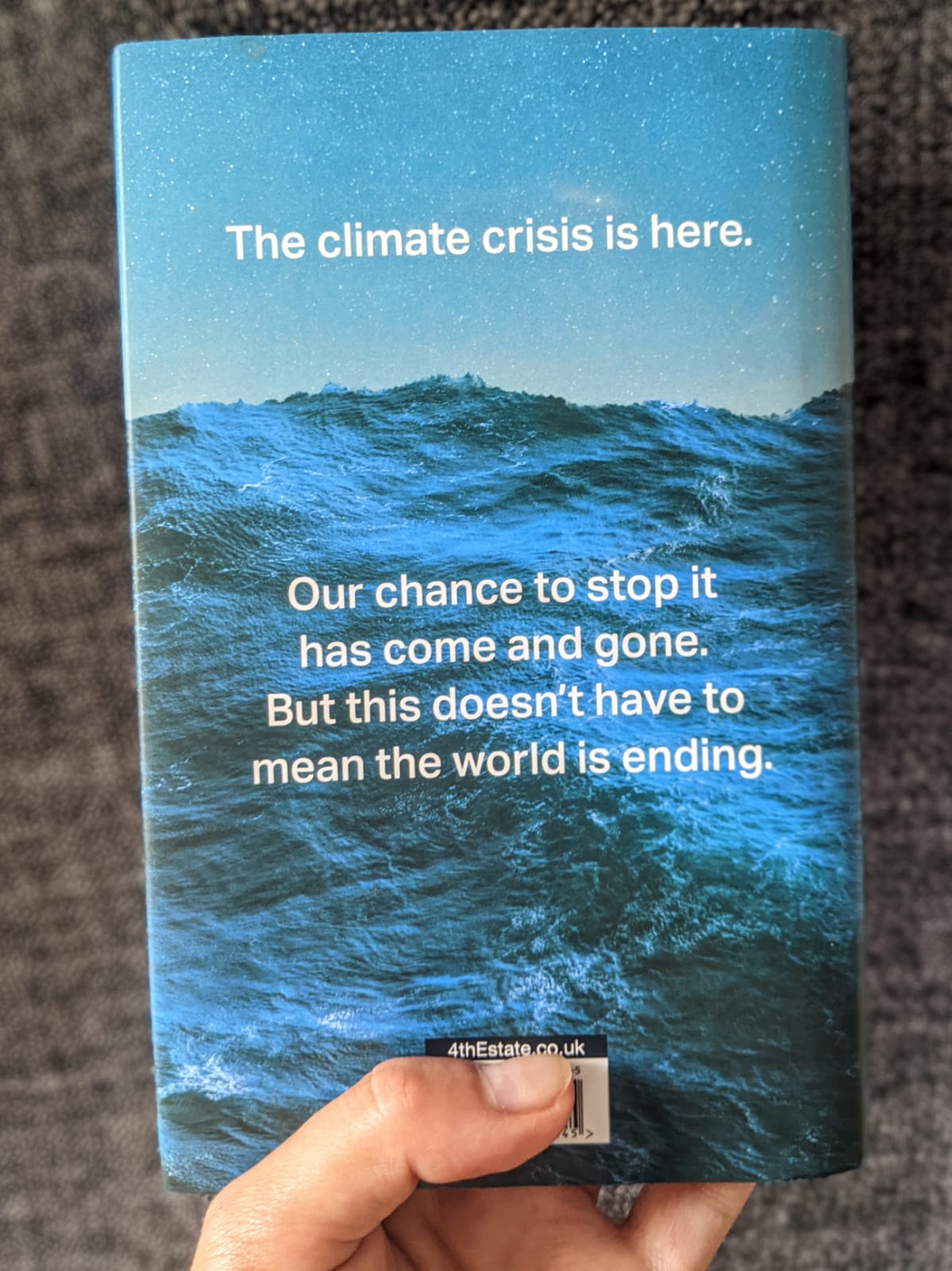 A picture of a copy of What If against a backdrop of palm leaves indoors